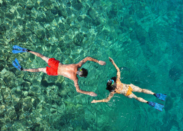 couple,snorkeling,at,phi,phi,island,,phuket,,thailand