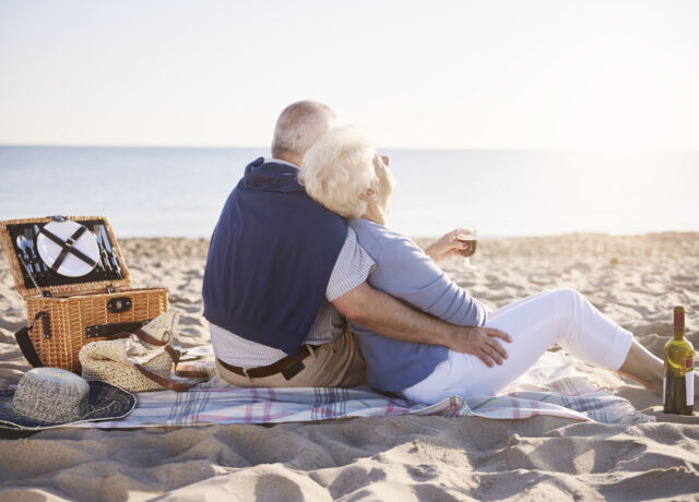 senior marriage having good morning on the beach